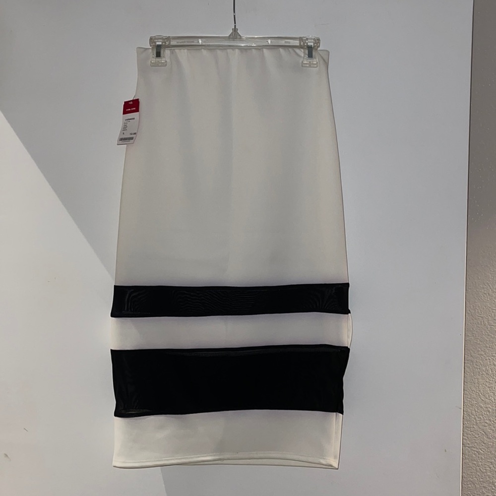 White skirt with sheer Tull detail in black.